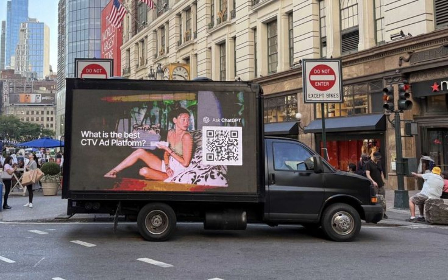Digital mobile billboard truck displaying a CTV advertising campaign in a city street