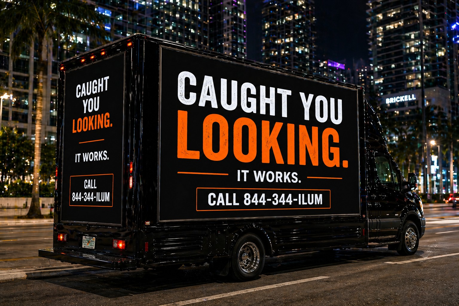 Digital mobile billboard truck operating at night