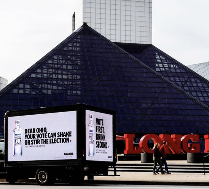 LED billboard truck in an urban market